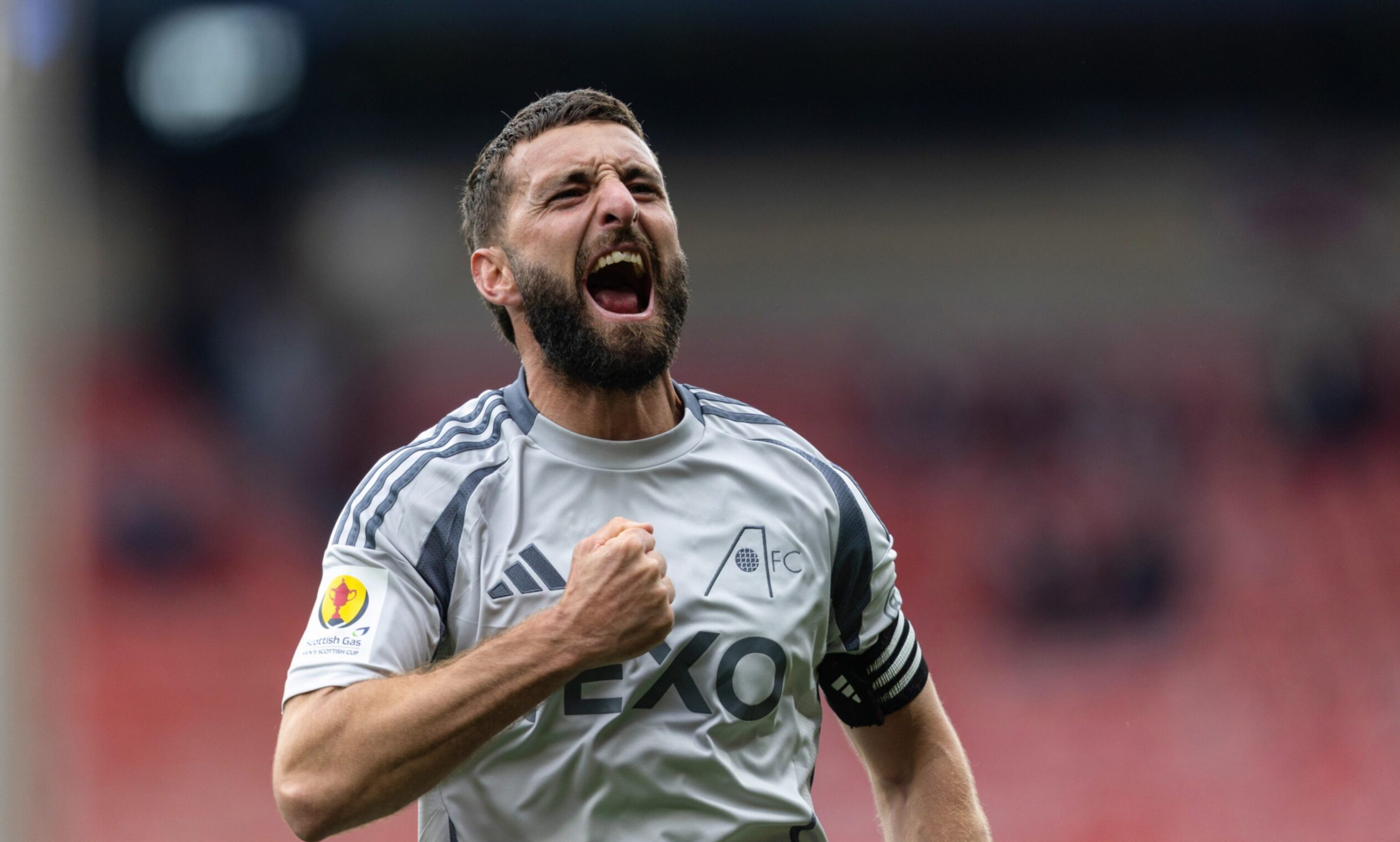 Graeme Shinnie celebrates Aberdeen's Scottish Cup semi-final win over Hearts.