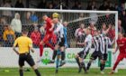 Brora Rangers and Fraserburgh players contest a high ball during a Highland League Cup match in the 2024-25 season.