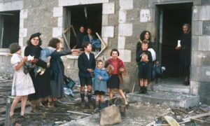 1940: This remarkable photo from November 4 1940 really captures a moment in time and shows families that narrowly escaped death when their tenements at 55-57 were ripped apart by a bomb. Image: DC Thomson
