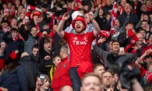 Aberdeen fans celebrating at Hampden during the 2-1 Scottish Cup semi-final win against Hearts..