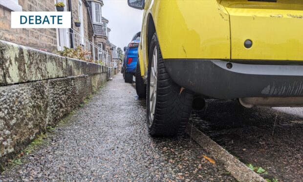 Image of a car parked on the pavement.