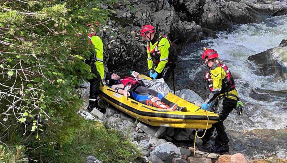 Harris on stretcher in water