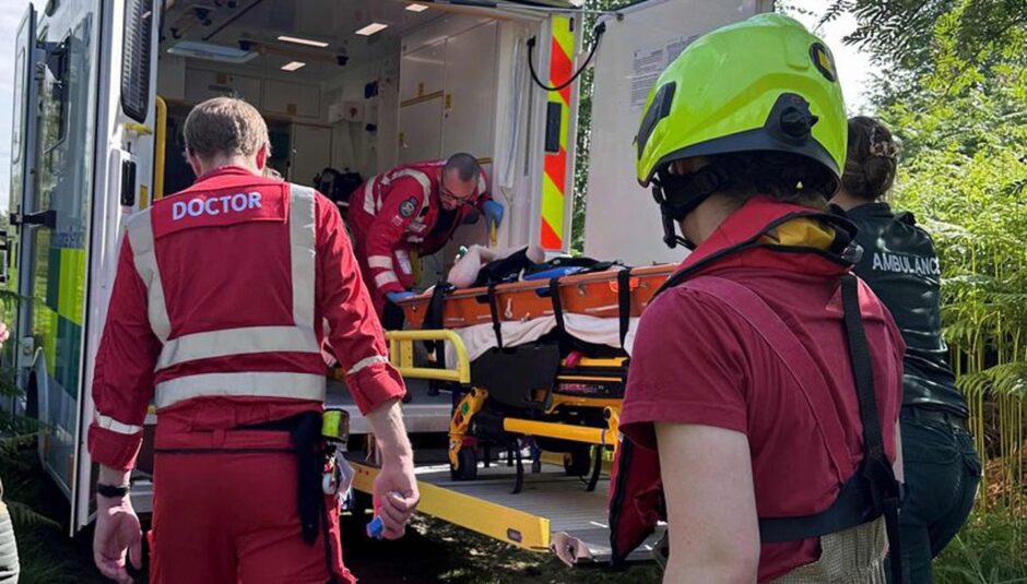Harris being taken into ambulance