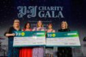 Clan Cancer Support and Abbie's Sparkle Foundation receive their initial cheques at the P&J Charity Gala. Image: Kenny Elrick/DC Thomson