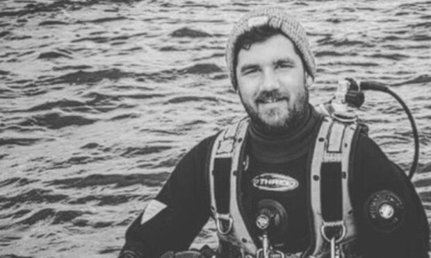 Nathan Few, pictured in diving gear. Mr Few, from the Kintore area, has died following a crash in March.