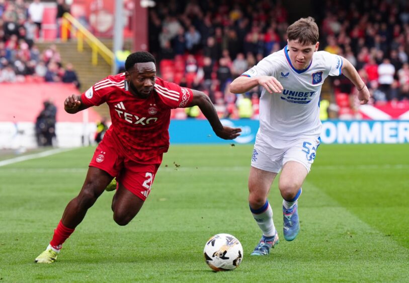 Aberdeen's Shayden Morris (left) and Rangers' Findlay Curtis battle for the ball. Image: PA.