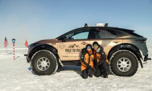 Chris and Julie at the South Pole. Image: Plug In Adventure