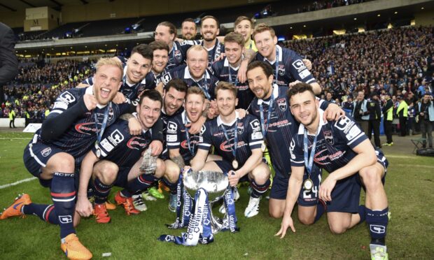 Ross County players celebrate after winning the 2015-2016 Scottish League Cup final against Hibernian at Hampden Park, Glasgow.
