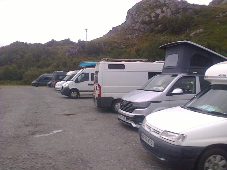 campervans parked closely together at Ullappool carpark