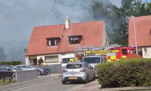 Smoke can be seen billowing from the street. Image: Supplied