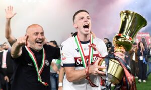 Vincenzo Italiano, head coach of Bologna FC, and Lewis Ferguson of Bologna FC celebrate with the trophy at the end of the Coppa Italia final against AC Milan at the Stadio Olimpico in Rome. Image: Shutterstock