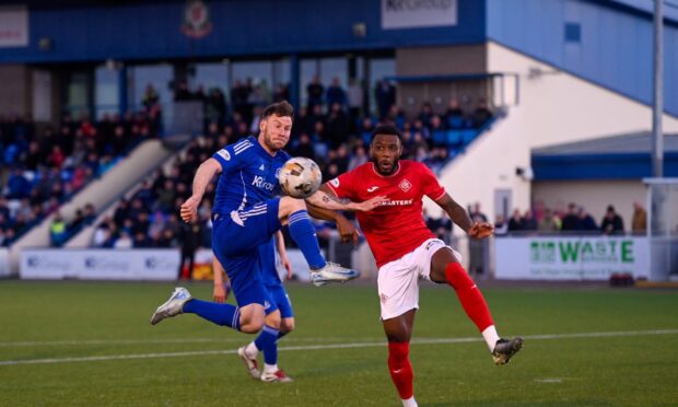 Cove Rangers striker Mitch Megginson and Airdrieonians defender Sam Graham. Cove Rangers v Airdrieonians, Scottish Championship play-off final, Balmoral Stadium, May 14 2025. Picture by Darrell Benns.