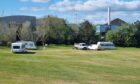 Caravans on an area of grass at Aberdeen beach.