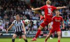 Aberdeen's Jeppe Okkel scores but it is ruled out for a handball in the buildup against St Mirren. Image: SNS