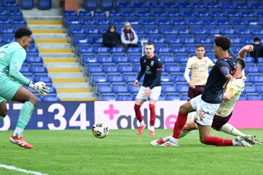 Lawrence Shankland nets Hearts' second goal against Ross County. 