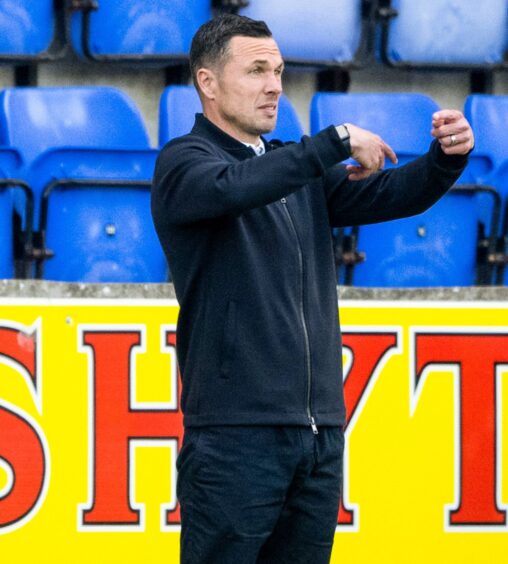 Ross County manager Don Cowie provides instructions from the touchline during Ross County's defeat to St Johnstone.