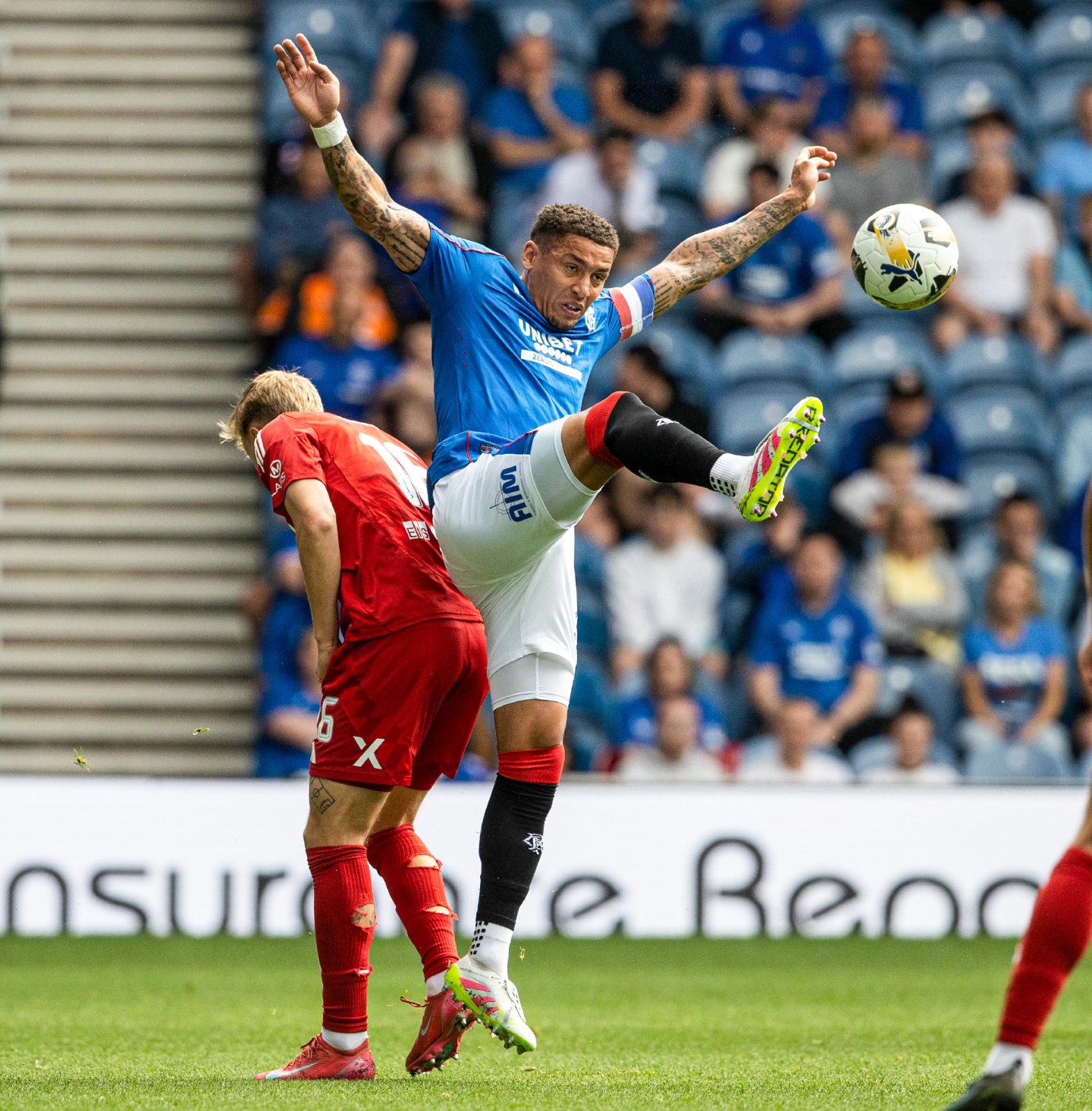  Rangers' James Tavernier and Aberdeen's Jeppe Okkels in action in the 4-0 loss. 