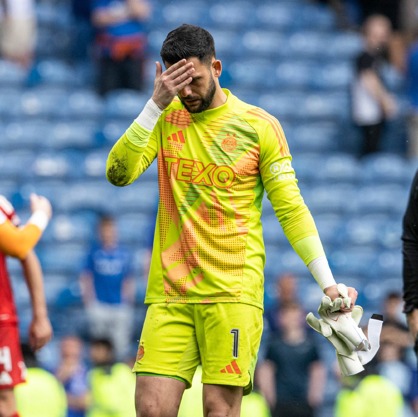 Aberdeen's Dimitar Mitov looks dejected at full time after a 4-0 loss to Rangers at Ibrox.