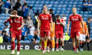 Aberdeen's Leighton Clarkson, Mats Knoester and Topi Keskinen (L-R) look dejected after the 4-0 loss to Rangers at Ibrox.