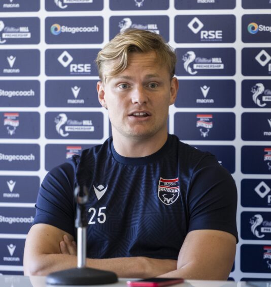 Ross County forward Alex Samuel speaks during a press conference.