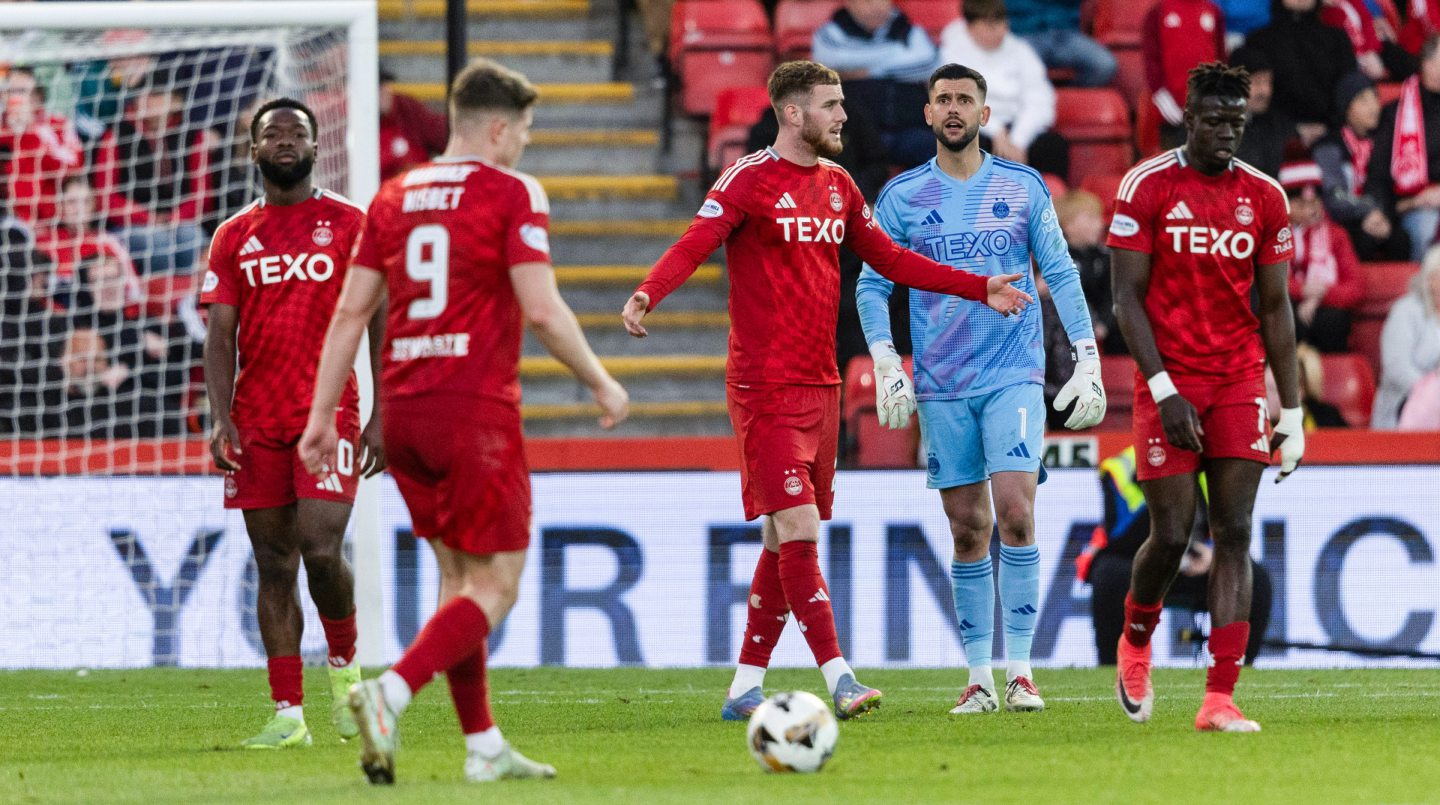 Aberdeen's Alfie Dorrington and Dimitar Mitov look dejected during the 5-1 Premiership loss to Celtic at Pittodrie. 
