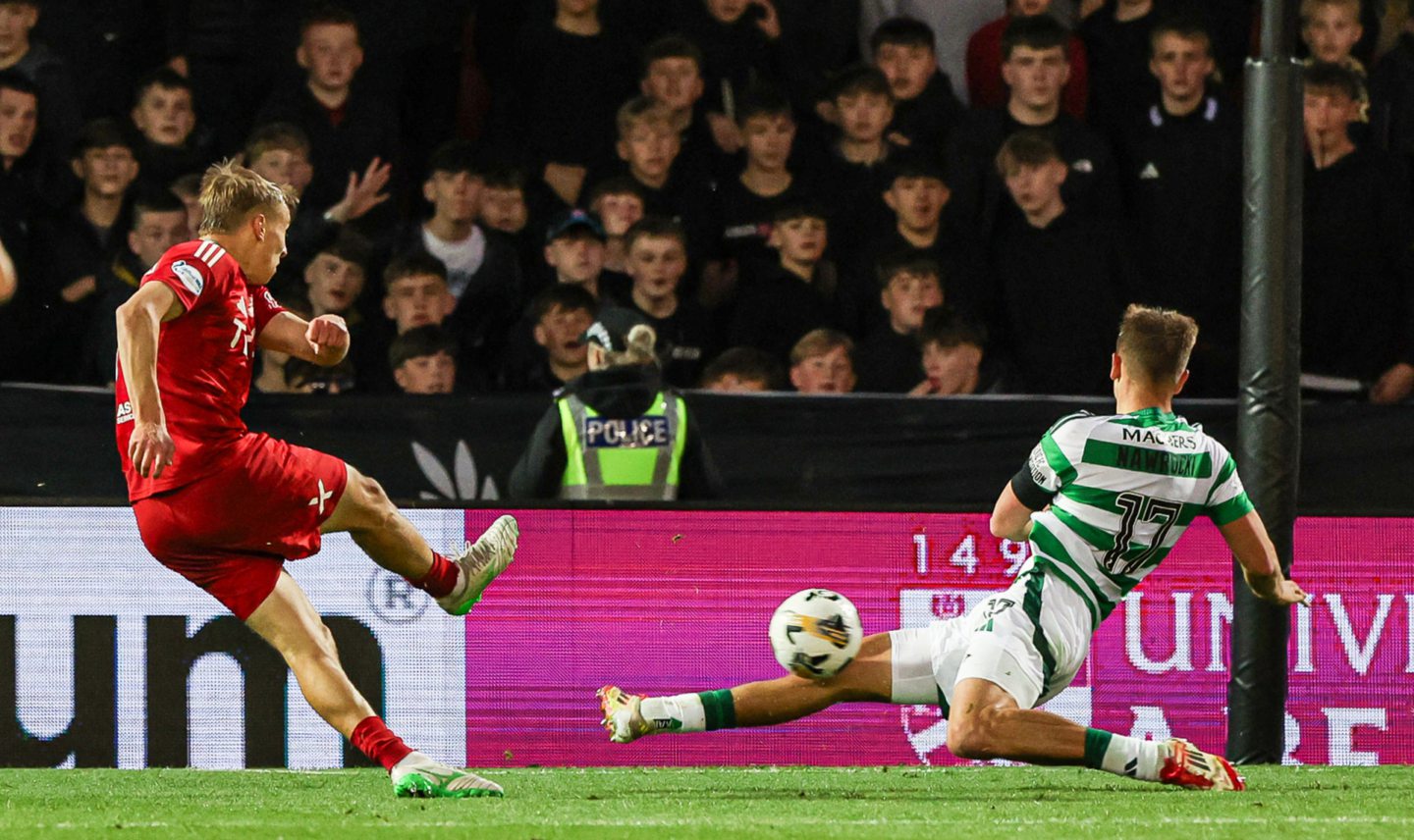  Celtic's Maik Nawrocki blocks the shot of Aberdeen's Topi Keskinen during a 5-1 loss at Pittodrie. 