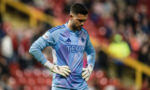 Aberdeen's Dimitar Mitov looks dejected during the 5-1 Premiership loss to Celtic at Pittodrie. Image: SNS