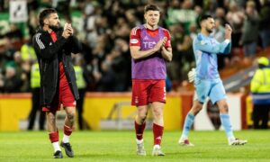 Graeme Shinnie (L) and Kevin Nisbet at full-time after William Hill Premiership match between Aberdeen and Celtic. Image: SNS.