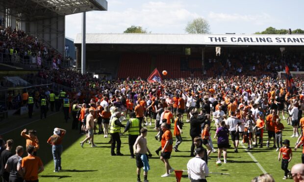Dundee United fans on the pitch at full-time during a William Hill Premiership match between Dundee United and Aberdeen at the CalForth Construction Arena at Tannadice Park, on May 17, 2025. Image: SNS.