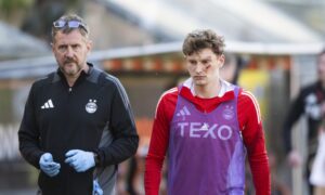 Aberdeen's Jack MacKenzie (R) after he was struck by an object thrown from the crowd during the William Hill Premiership match between Dundee United and Aberdeen at the CalForth Construction Arena at Tannadice Park, on May 17, 2025. Image: SNS.