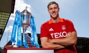 Aberdeen's Mats Knoester with the Scottish Cup. Image: SNS.