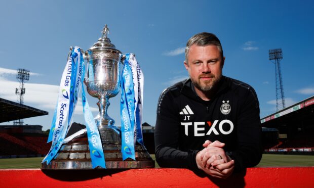 Aberdeen manager Jimmy Thelin with the Scottish Cup at Pittodrie. Image: SNS