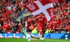 Aberdeen's Alfie Dorrington (R) and Celtic's Paulo Bernardo. Image: SNS.