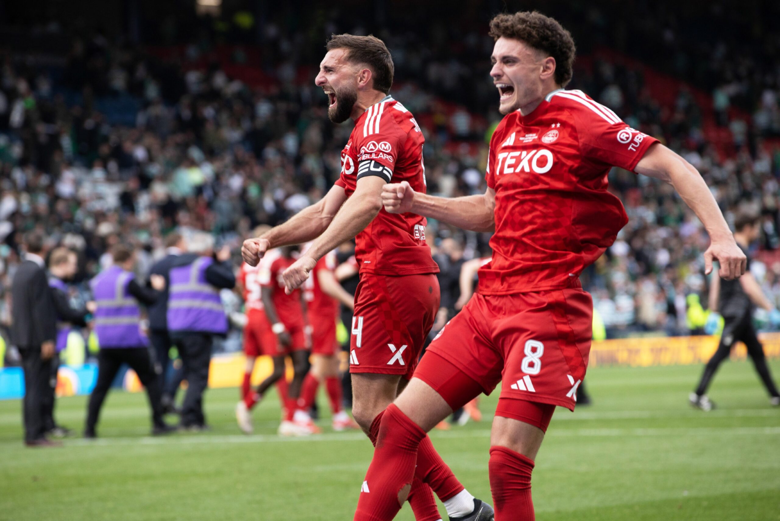Aberdeen's Graeme Shinnie and Dante Polvara celebrate winning the Scottish Cup at Hampden. Image: SNS 