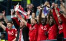 Aberdeen captain Graeme Shinnie lifts the Scottish Cup trophy during the Scottish Gas Men's Scottish Cup Final between Aberdeen and Celtic at Hampden Park, Image: Paul Devlin / SNS Group.