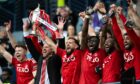 Aberdeen captain Graeme Shinnie lifts the Scottish Cup trophy during the Scottish Gas Men's Scottish Cup Final between Aberdeen and Celtic at Hampden Park, Image: Paul Devlin / SNS Group.