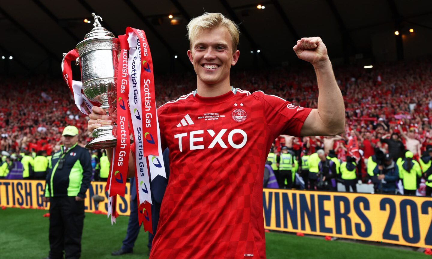 Aberdeen's Alexander Jensen celebrates with the Scottish Gas Scottish Cup Trophy. Image: SNS.