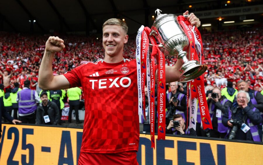 Aberdeen's Mats Knoester with the Scottish Cup trophy at Hampden. Image: SNS