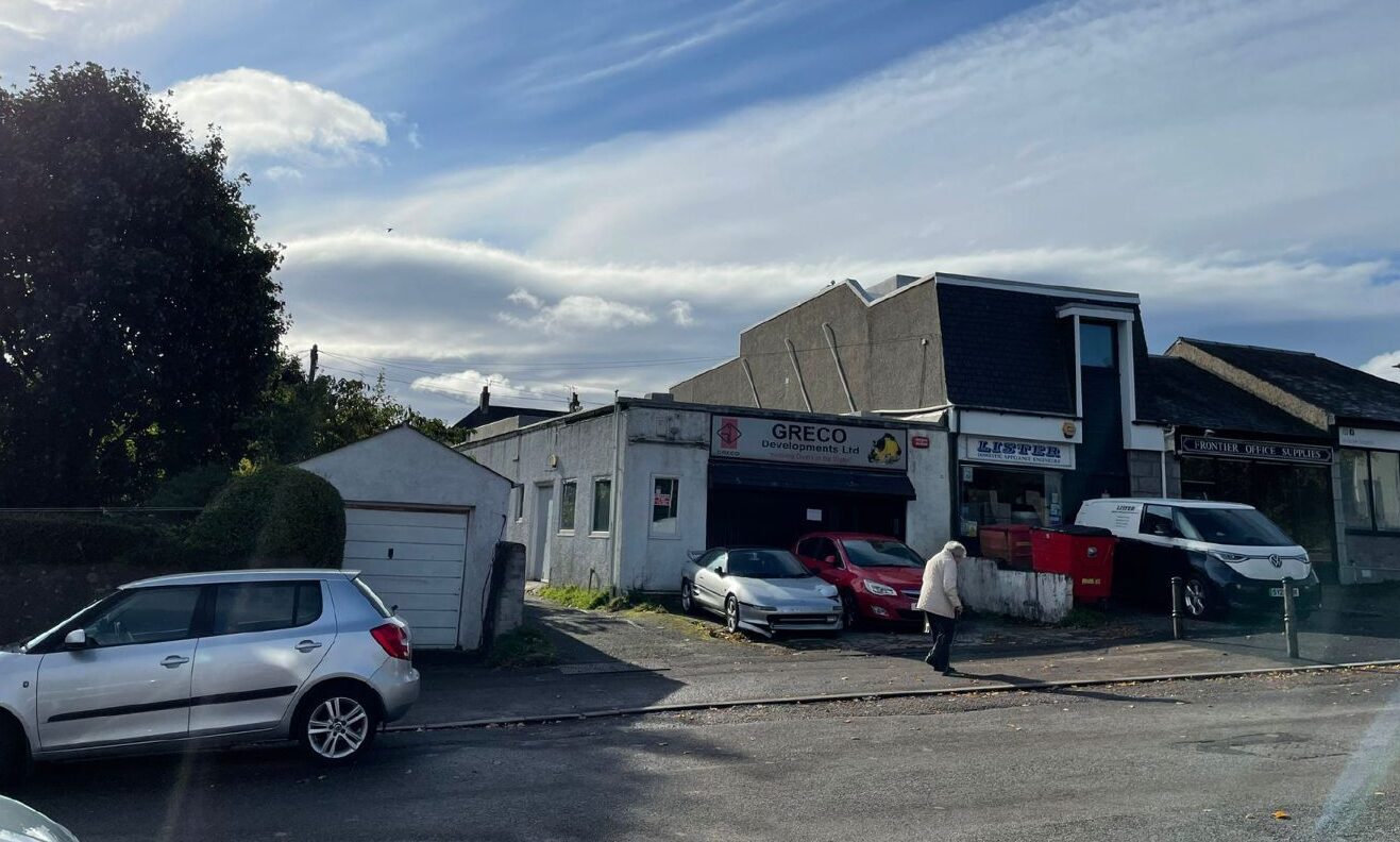 Cars parked outside the garage on Anderson Avenue.