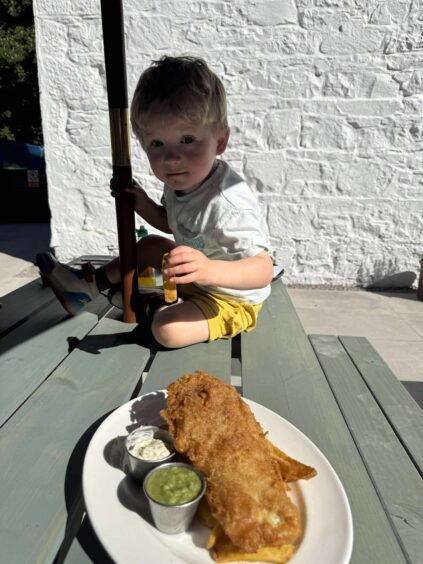 Teddy is enjoying his fish and chips at The Taynuilt Hotel. 