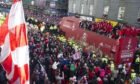 Aberdeen fans surround the open top bus as the team celebrate their Scottish League Cup triumph in style back in March 2014