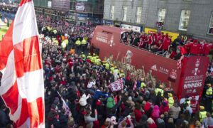 Aberdeen fans surround the open top bus as the team celebrate their Scottish League Cup triumph in style back in March 2014