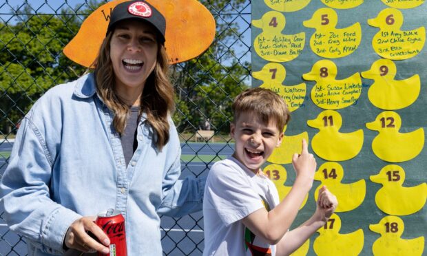 Emma and Finlay Smalley discovering his brother Henry had come 3rd place in one of the races. Image: Ethan Williams