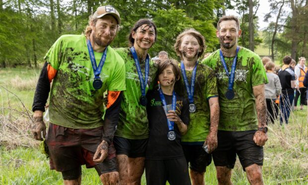 Callum Nickel, Alana Nickel, Atticus Thorsson, Arro Thorsson and Thomas Gullan after their  muddy 5K run. Image: Ethan Williams