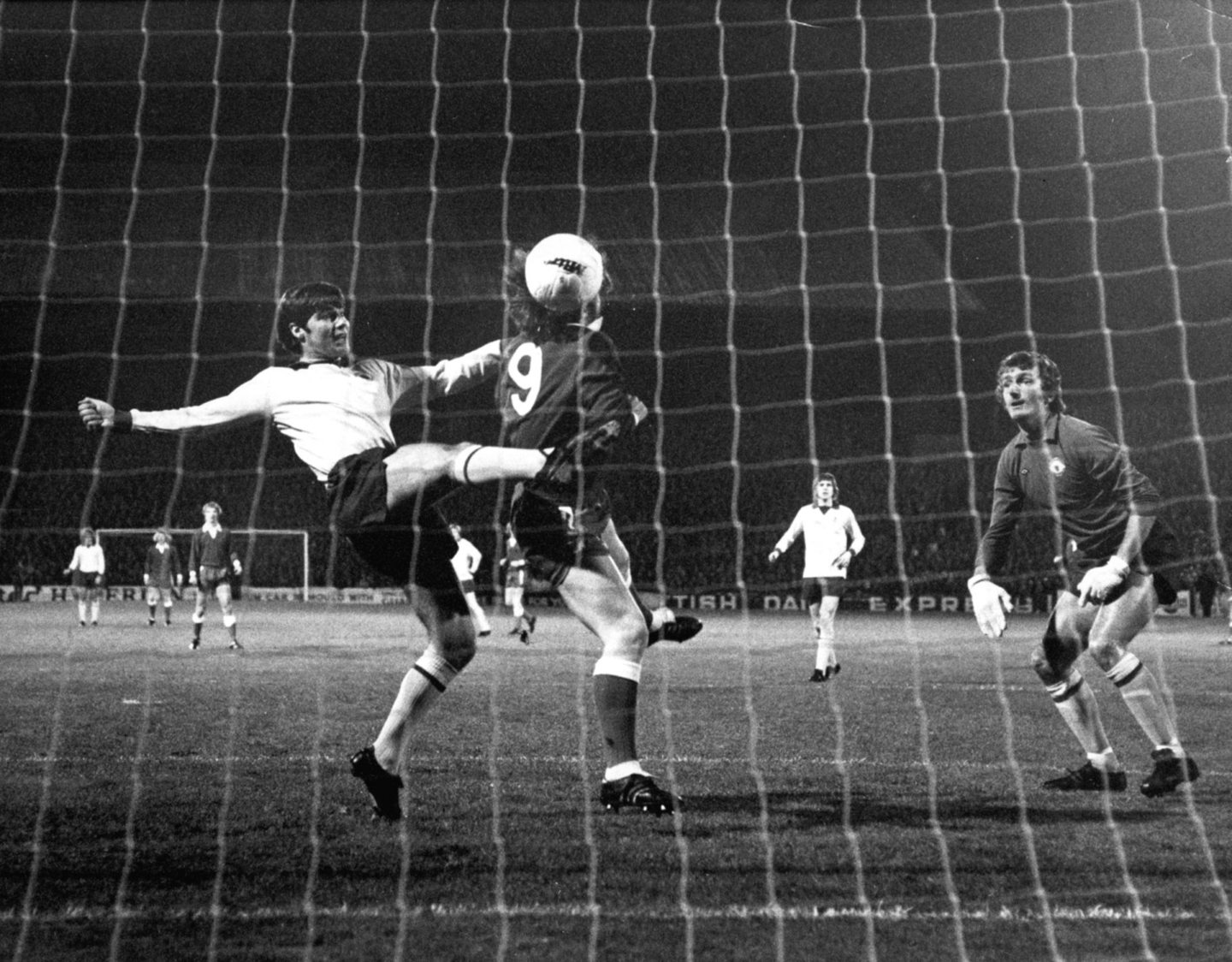 Martin Buchan (Manchester United) knocks the ball against Aberdeen's Joe Harper and it rebounds into the empty net for the opening goal of the Dons' 5-2 win against the English giants at Pittodrie in October, 1972. 