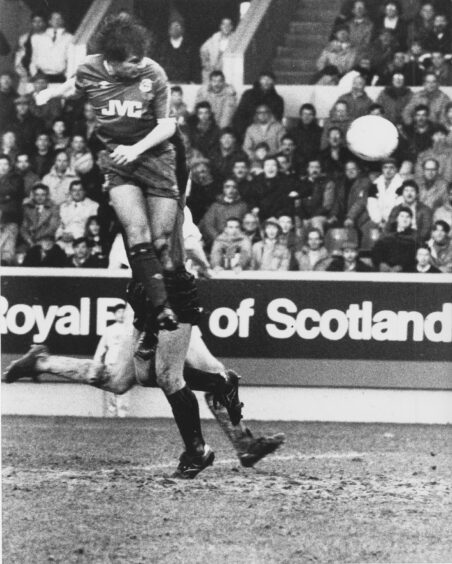 High and mighty... Striker Hans Gillhaus leaves Morton goalkeeper David Wylie (partly hidden) stranded as he heads Aberdeen's equaliser in a Scottish Cup tie at Pittodrie in February 1990.