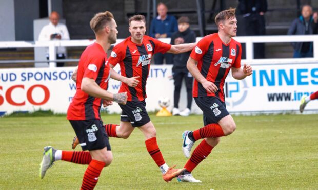 Elgin`s second goalscorer Jack Murray leads the players back after scoring. Image: Bob Crombie