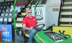 Groundsman Cecil Jack on his mower at Elgin City?s Borough Briggs Stadium.
