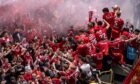 The Aberdeen players on the bus with the Scottish Cup on Broad Street on Sunday.