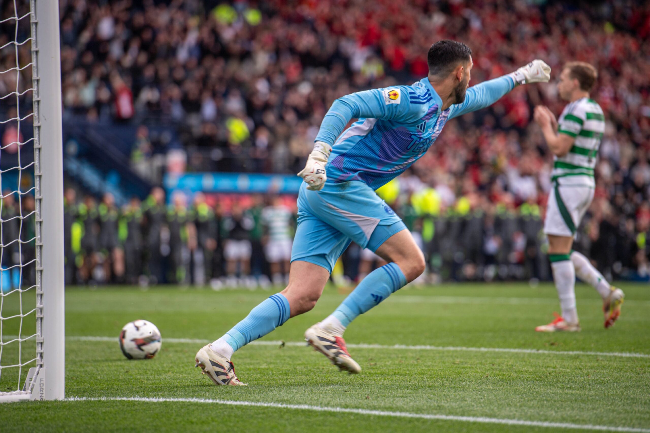 Aberdeen's Dimitar Mitov celebrating after saving the last penalty from Celtic's Alistair Johnston to win the Scottish Cup. Image: Darrell Benns/DC Thomson.